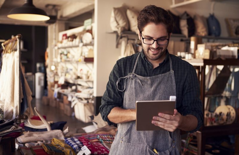 Male Owner Of Gift Store With Digital Tablet