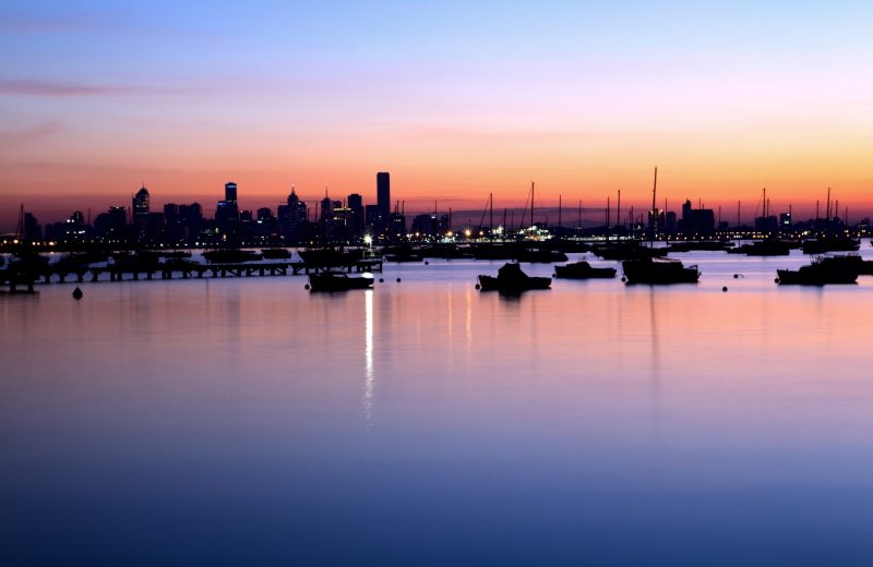 Portside industrial action threatens retail recovery and jobs Melbourne port at sunset