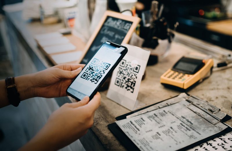 Ey Customer Scanning Qr Code Making Contactless Payment in a Cafe