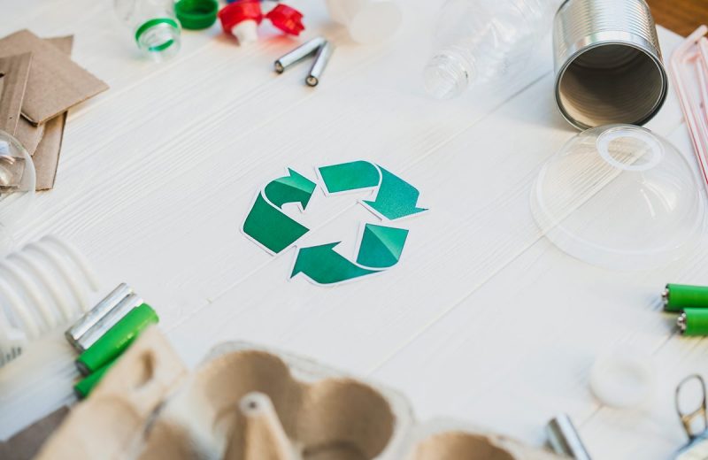 Green Recycle Symbol Surrounded With Waste Items Sml
