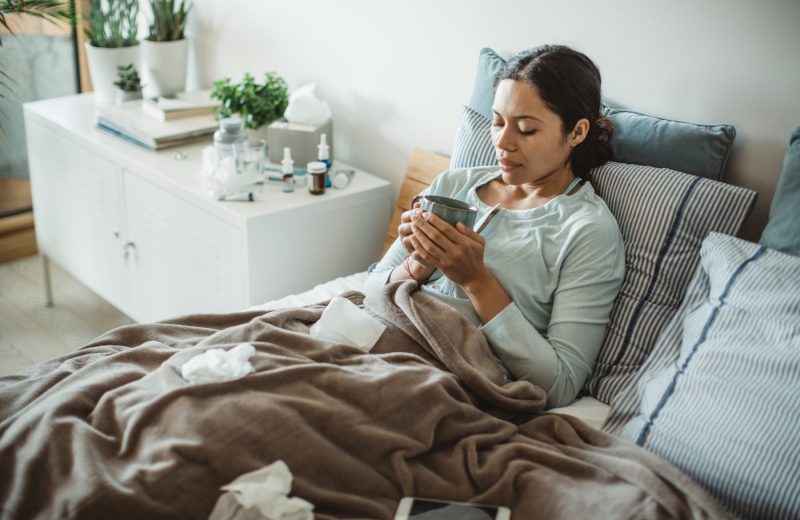 sick woman home in bed